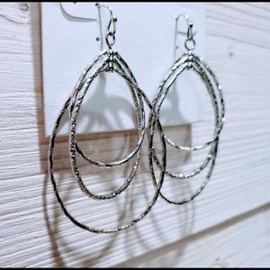 Silvertone Pierced Oval Hoop Earrings